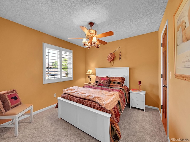 7335 S Milwaukee Way, Centennial, CO 80122 - carpeted bedroom with a textured ceiling and a ceiling fan