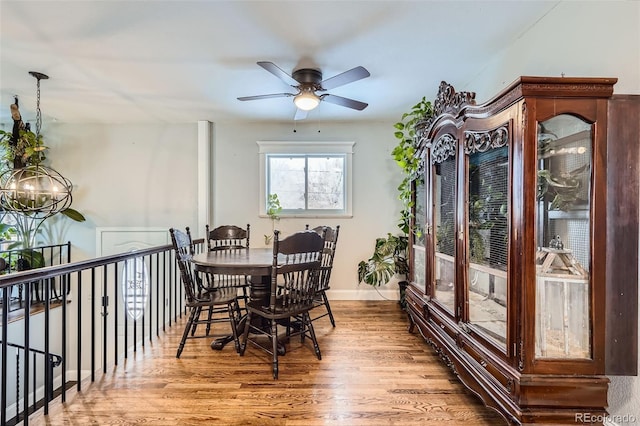 dining area featuring hardwood / wood-style flooring and ceiling fan