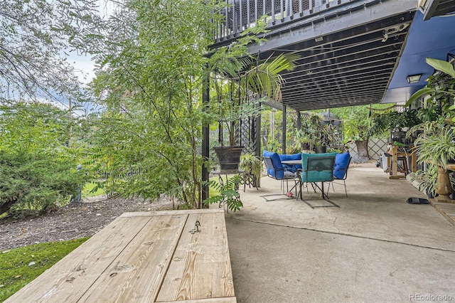 view of patio featuring a balcony