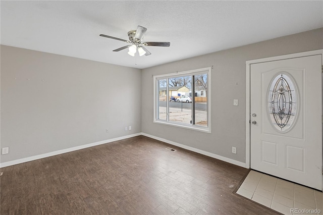 entryway featuring ceiling fan and dark hardwood / wood-style floors