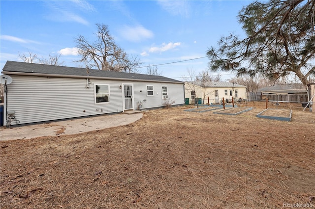 rear view of property featuring a patio