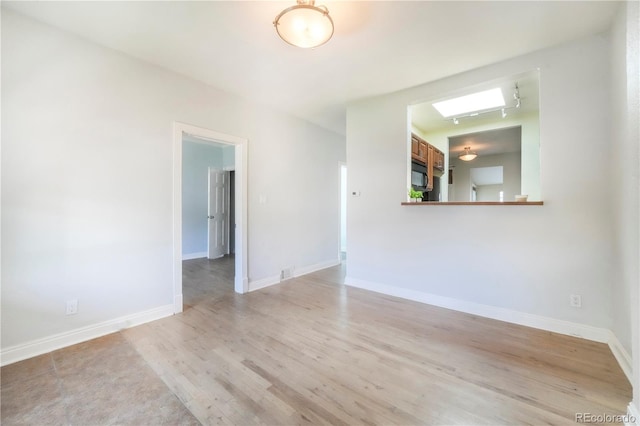 22 E Bayaud Ave, Denver, CO 80209 - unfurnished room featuring light wood-style flooring and baseboards