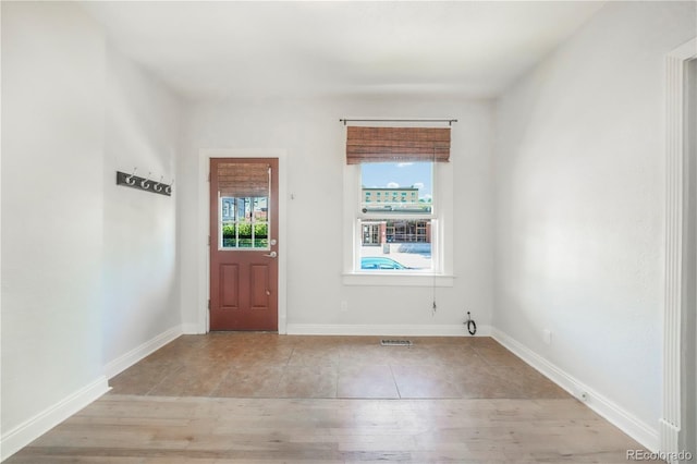 22 E Bayaud Ave, Denver, CO 80209 - entryway with light wood-type flooring and baseboards