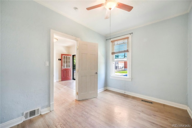 22 E Bayaud Ave, Denver, CO 80209 - spare room with light wood finished floors and a ceiling fan