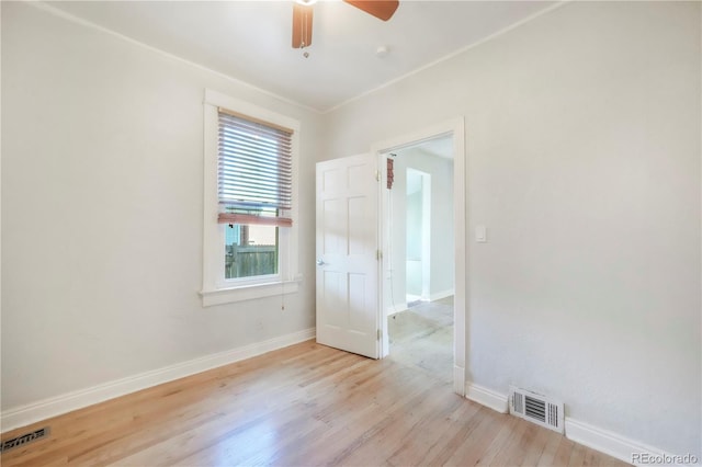 22 E Bayaud Ave, Denver, CO 80209 - empty room with light wood-style flooring and ceiling fan