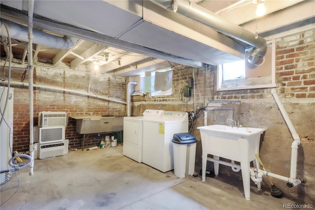 22 E Bayaud Ave, Denver, CO 80209 - below grade area with separate washer and dryer and brick wall