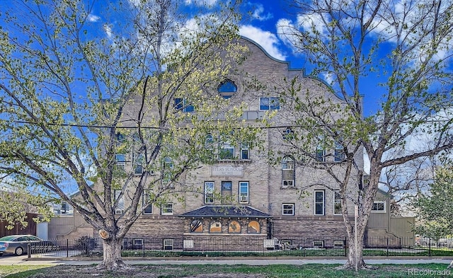view of building exterior featuring fence