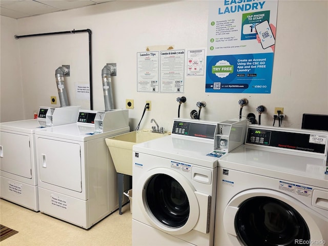 community laundry room featuring washer and clothes dryer
