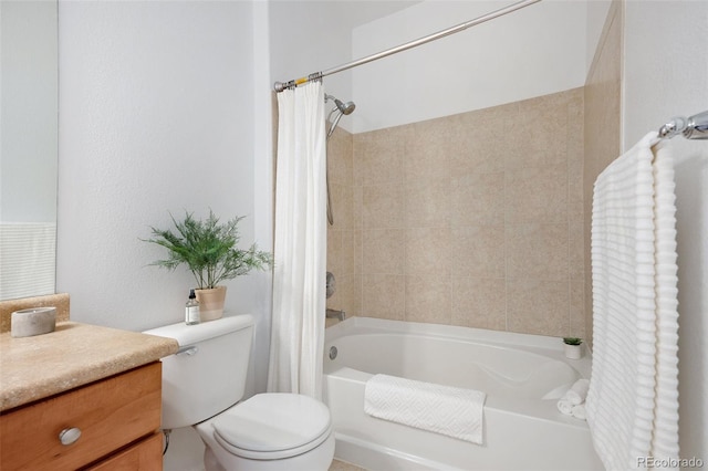 full bathroom with vanity, shower / bath combo, and toilet