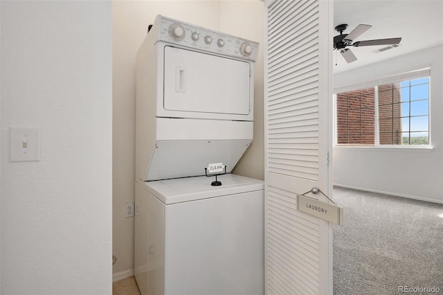 washroom featuring stacked washer and dryer, carpet floors, and ceiling fan