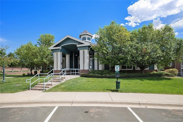 view of front of home featuring a front lawn