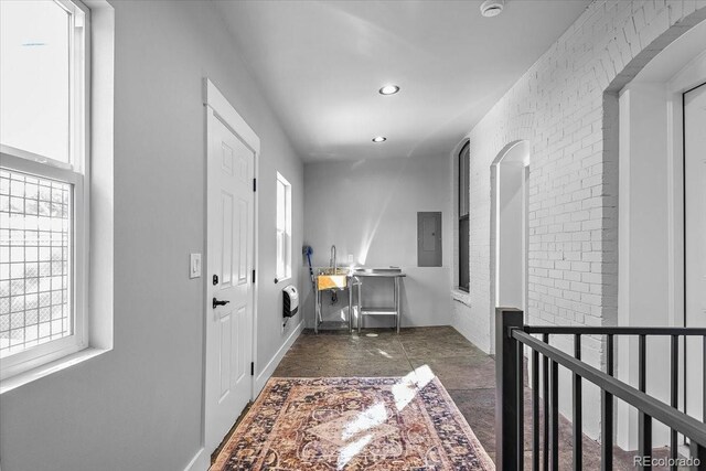 813 E B St, Pueblo, CO 81003 - hallway featuring a wealth of natural light and electric panel