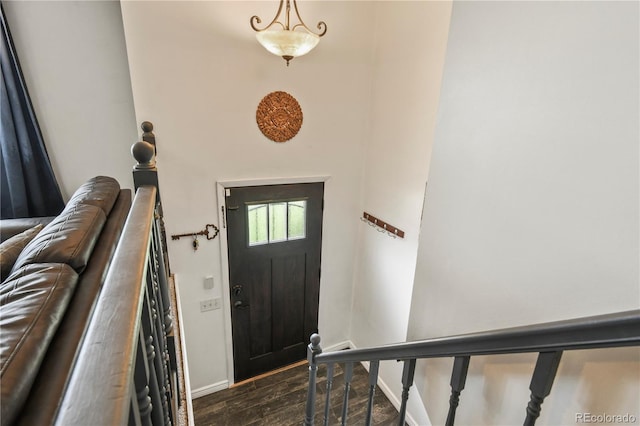 8410 Gray St, Arvada, CO 80003 - entrance foyer featuring baseboards, dark wood-style floors, and a towering ceiling
