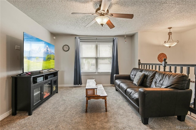 8410 Gray St, Arvada, CO 80003 - carpeted living room featuring a textured ceiling, ceiling fan, and baseboards