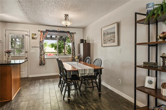 8410 Gray St, Arvada, CO 80003 - dining area featuring dark wood finished floors, a textured ceiling, and baseboards