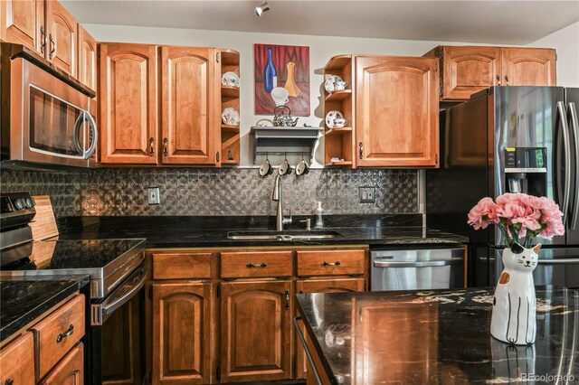 8410 Gray St, Arvada, CO 80003 - kitchen featuring stainless steel appliances, a sink, open shelves, and dark stone counters