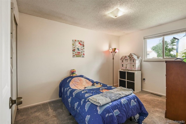 8410 Gray St, Arvada, CO 80003 - carpeted bedroom featuring a textured ceiling and baseboards