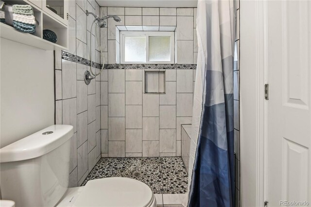 8410 Gray St, Arvada, CO 80003 - bathroom featuring toilet and a shower stall