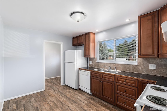 867 S Grape St, Denver, CO 80246 - kitchen with white appliances, tile countertops, backsplash, dark wood-style floors, and recessed lighting
