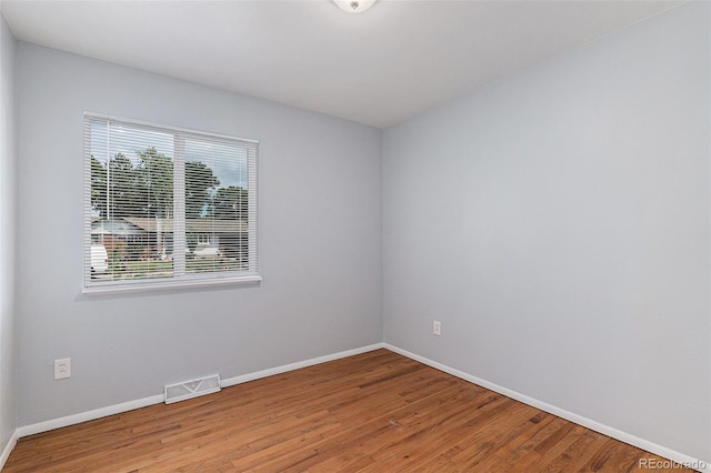 867 S Grape St, Denver, CO 80246 - empty room with wood finished floors and baseboards