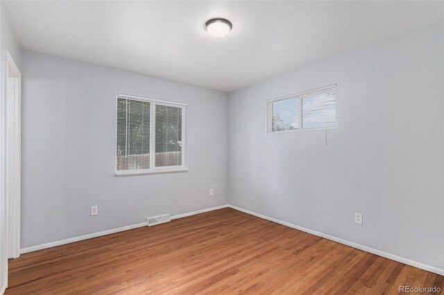867 S Grape St, Denver, CO 80246 - empty room with light wood-style floors and baseboards