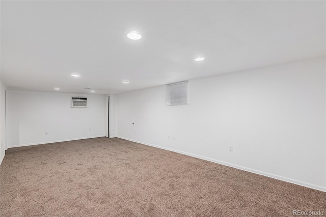 867 S Grape St, Denver, CO 80246 - finished below grade area with carpet floors, recessed lighting, and a wall unit AC