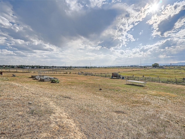 view of yard with a rural view