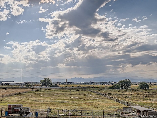 view of yard with a rural view