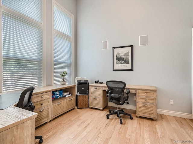 home office with light wood-type flooring