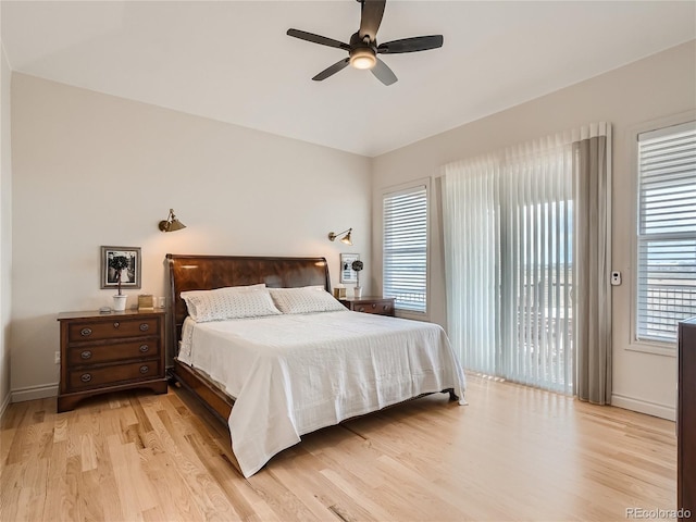 bedroom with light hardwood / wood-style floors, access to outside, and ceiling fan