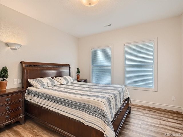 bedroom with light hardwood / wood-style floors