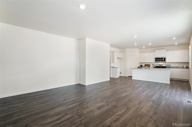 unfurnished living room with dark hardwood / wood-style floors