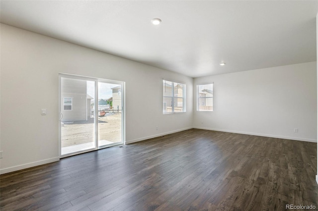 empty room with dark wood-type flooring