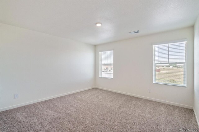 empty room featuring carpet flooring