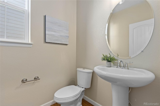 bathroom with toilet and sink