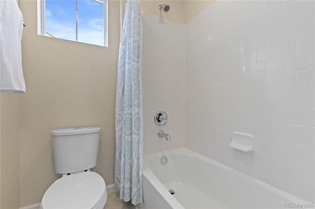 bathroom with shower / bath combo and toilet