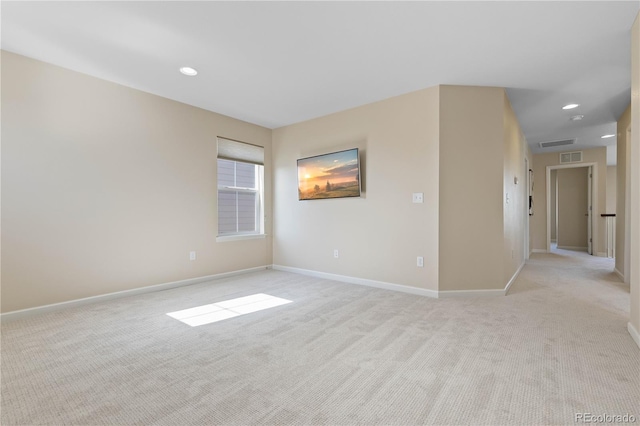 empty room with light colored carpet