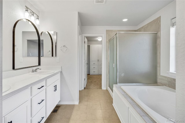 bathroom featuring tile patterned flooring, vanity, and independent shower and bath