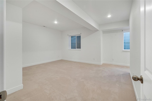 unfurnished room with light carpet