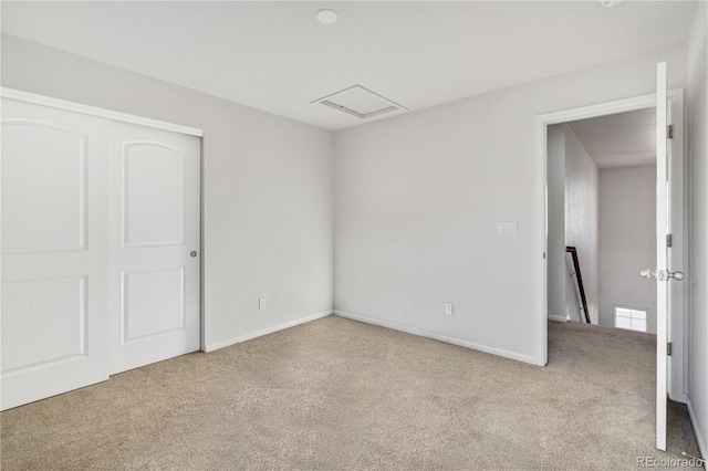 empty room with light colored carpet