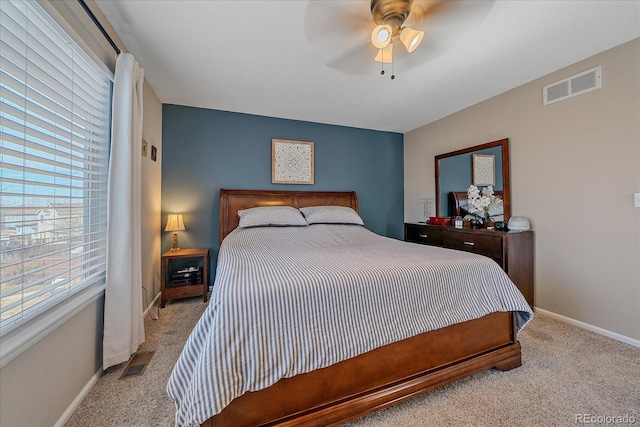 bedroom featuring carpet, visible vents, and baseboards