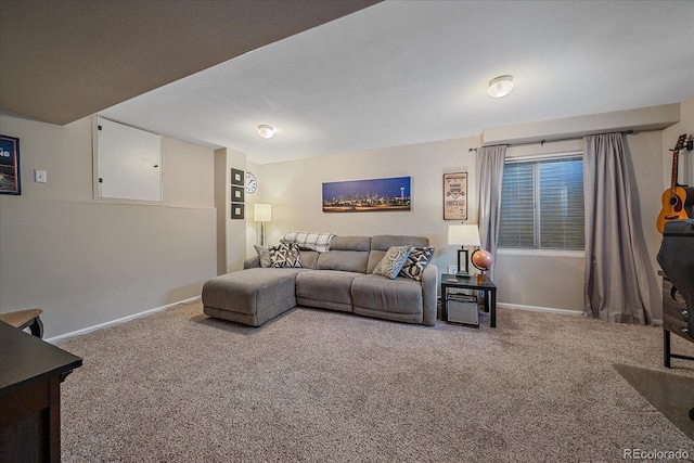 carpeted living room featuring baseboards