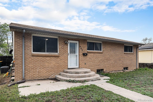 547 S 3rd Ave, Brighton, CO 80601 - ranch-style home featuring fence, brick siding, central AC, and roof with shingles