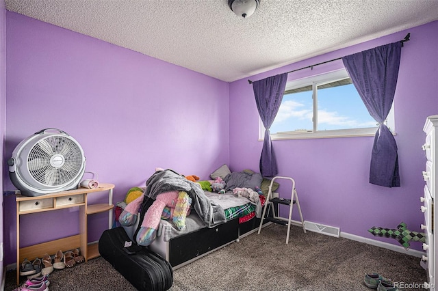 547 S 3rd Ave, Brighton, CO 80601 - carpeted bedroom featuring a textured ceiling and baseboards