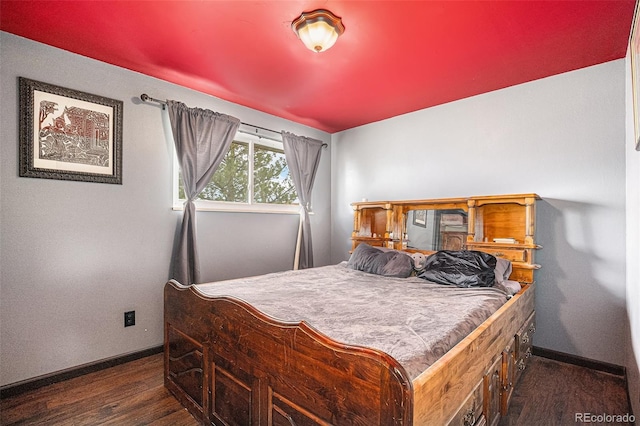 547 S 3rd Ave, Brighton, CO 80601 - bedroom with dark wood-style flooring and baseboards