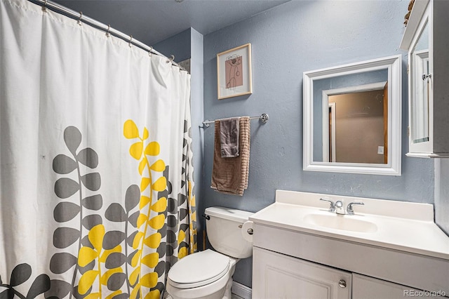 547 S 3rd Ave, Brighton, CO 80601 - full bath featuring vanity, a textured wall, toilet, and a shower with shower curtain