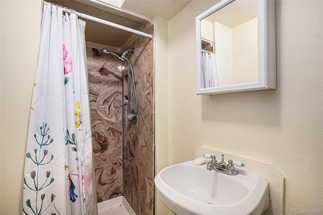 547 S 3rd Ave, Brighton, CO 80601 - bathroom featuring a sink and a stall shower