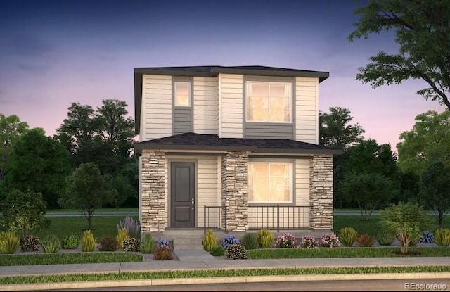 view of front of home featuring stone siding