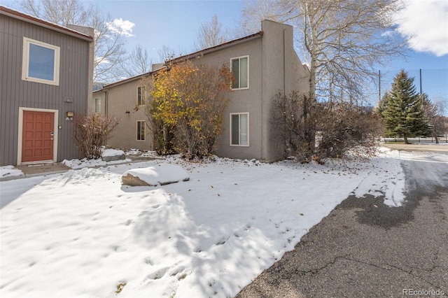 view of snow covered house