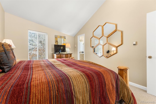 bedroom with vaulted ceiling and carpet floors